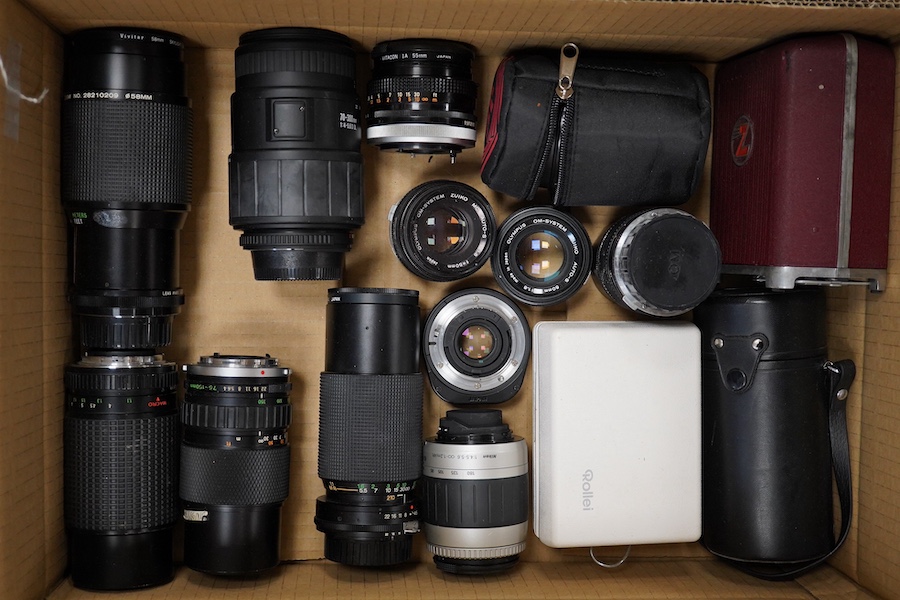 Eight SLR and DSLR camera bodies by Nikon, Zenit-E, Fujifilm, Canon, etc., together with thirteen lenses, a boxed Rollei A110 and other accessories including camera cases, etc. Condition - poor to fair.